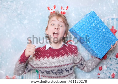 Cute Smiling Child With Gift Christmas Box 