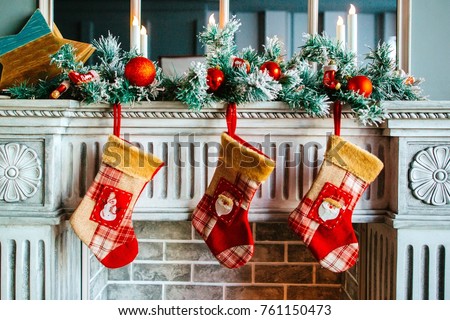 Christmas stockings are on the fireplace