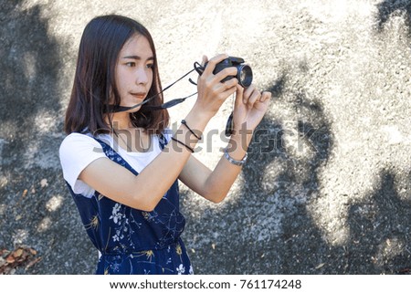 Woman tourist taking pictures on vacation.