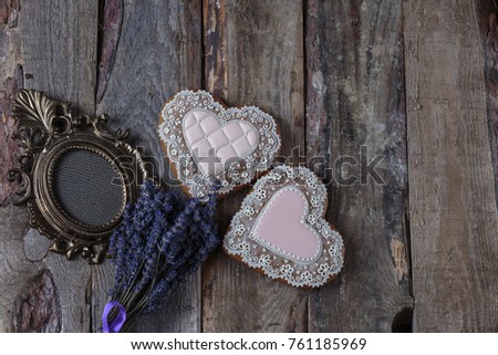 two hearts, photo frame, lavender on a wooden background
