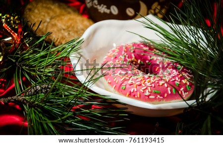 Bagel with branches of Christmas tree in a plate