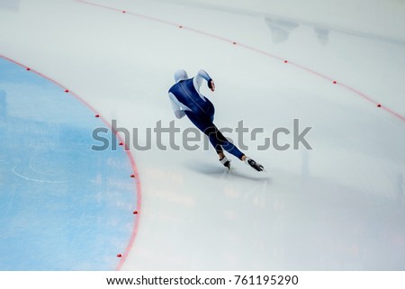 male athlete speed skater skate turn in ice-skating