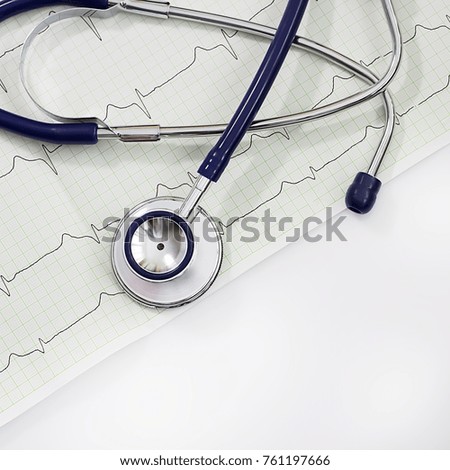 Health care concept. A stethoscope and cardiogram on a white table. 