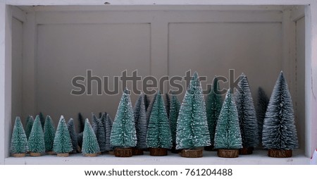 Small Christmas Artificial Tree with snow for table decoration.