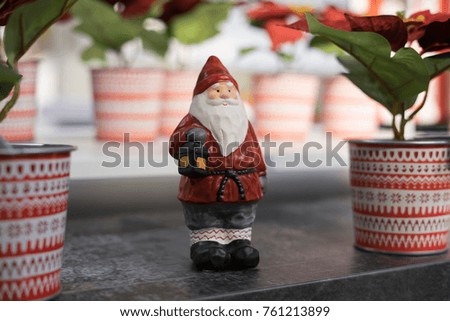 Close up shot of a red and white santa claus gnome statue for christmas decoration.