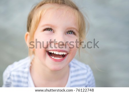 Portrait of a beautiful liitle girl close-up Royalty-Free Stock Photo #76122748