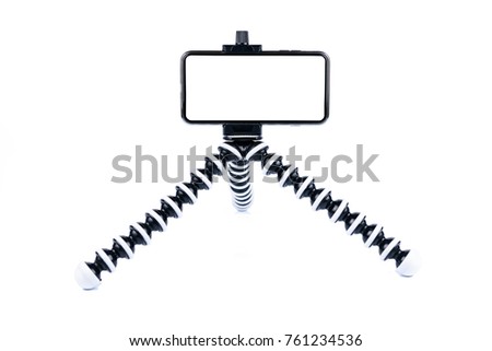 Smartphone or mobile is placed on a octopus tripod. To prepare for shooting picture or video. on white background or isolated