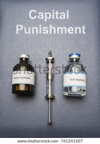 Vintage syringe and drugs used in lethal injection on a book of Capital Punishment, digital composition, conceptual image