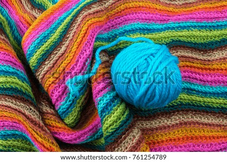 Blue Yarn Ball Thread on Scarf Background.