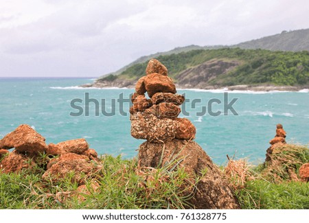 Pebble tower on the seaside, cape Promthep