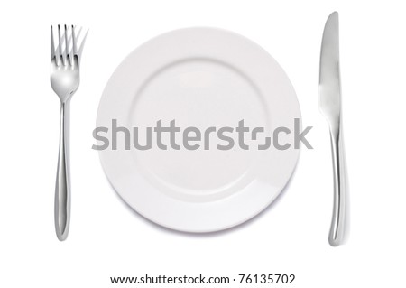 closeup of a place setting with dinner-plate Royalty-Free Stock Photo #76135702