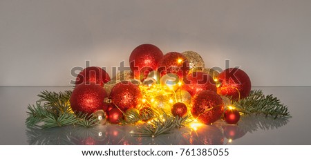 Christmas Balls and Fairy Lights on the glass table