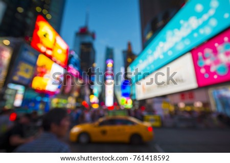 Defocus abstract view of Times Square signage, traffic, and holiday crowds in the lead-up to New Year's Eve in New York City, USA