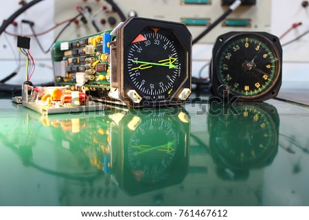Power supply  circuit board ,compass indicator  and electronics circuit of indicator ,indicator of Avionics System ,Navigation system ,Avionics equipment in aircraft with maintenance. Royalty-Free Stock Photo #761467612