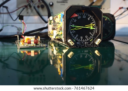 Power supply  circuit board ,compass indicator  and electronics circuit of indicator ,indicator of Avionics System ,Navigation system ,Avionics equipment in aircraft with maintenance. Royalty-Free Stock Photo #761467624