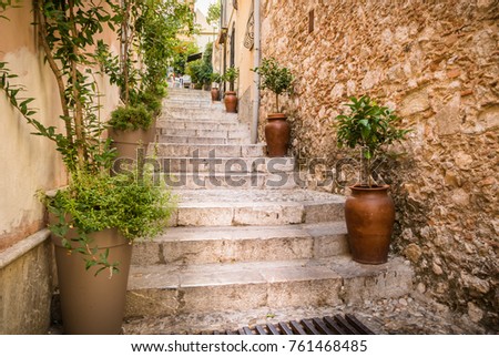 Classic Sicilian alleyway and stairs lined with plants