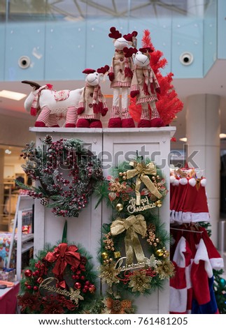 Lots of Toys,Christmas Hat and Christmas decoration on a white cupboard at the shopping mall.