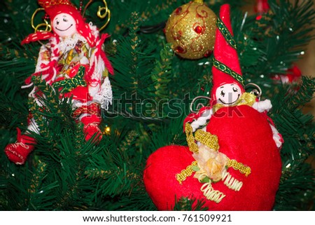 Close Up of Homemade Red and White Elf of Cloth Decorations  On the Christmas Tree At Home during the Christmas Period