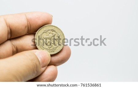 British coins 1 GBP in hand