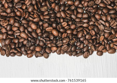 Frame of coffee beans with free space for text, white background top view