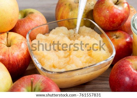 an applesauce with apples on a wooden table Royalty-Free Stock Photo #761557831
