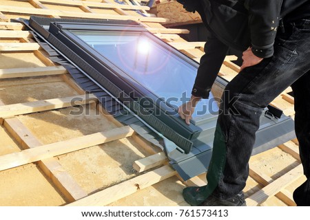 Installing a skylight Royalty-Free Stock Photo #761573413