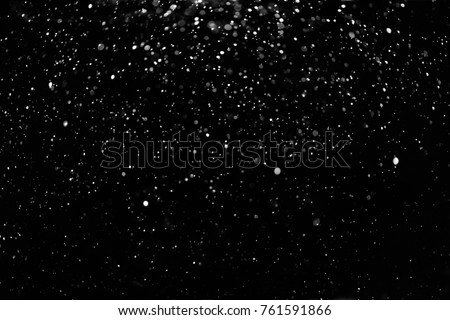Falling Snow down On The Black Background. Royalty-Free Stock Photo #761591866
