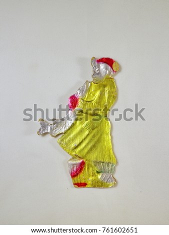Christmas tree toy, an old toy made of cardboard, a cartoon character emel in a yellow sheepskin coat with a pike in his hands