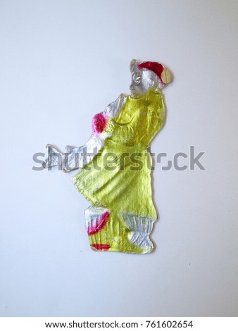 Christmas tree toy, an old toy made of cardboard, a cartoon character emel in a yellow sheepskin coat with a pike in his hands