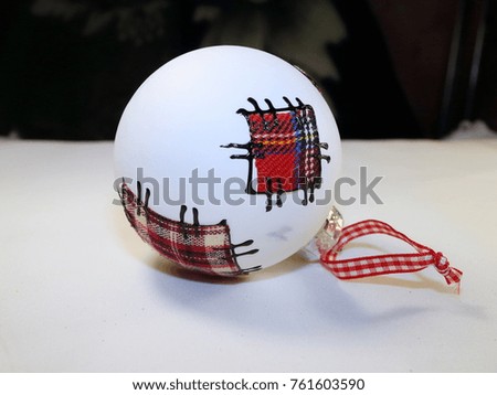Christmas tree decoration white ball with patches made of checkered red-white fabric