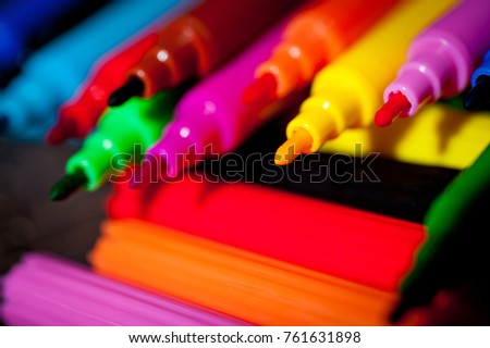 Felt pens bright, colorful on a dark background