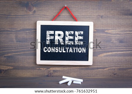 Free Consultation. Business success and customer service concept. Chalkboard on a wooden background 
