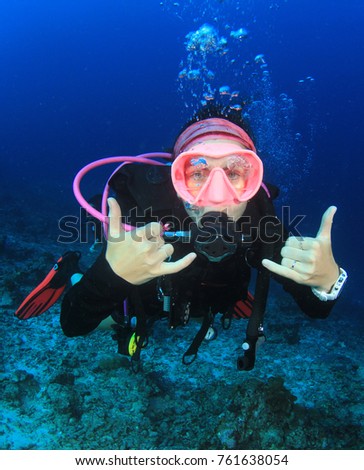 Scuba dive. Young woman diving instructor