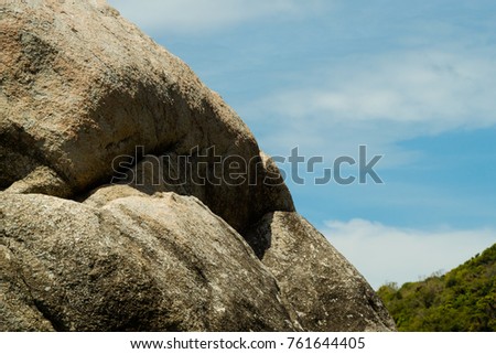 A granite rock face next to the beach; picture taken at Koh Pha Ngan, Thailand. 