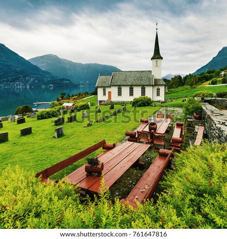 Great summer view of Nes Church,  parish church in Luster Municipality in Sogn og Fjordane county, Norway. Splendid morning scene of village of Nes, on the western shore of the Lustrafjorden.