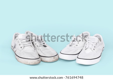 Pair of clean and dirty sneakers on turquoise background Royalty-Free Stock Photo #761694748