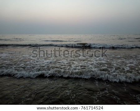 Waves hitting the shore of the Arabian Sea, India. Shot at Juhu beach, Mumbai . Royalty-Free Stock Photo #761714524