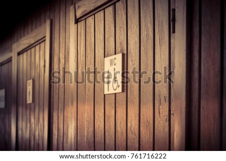 Female Toilets icon, Public restroom signs on wooden background, disabled person bathroom