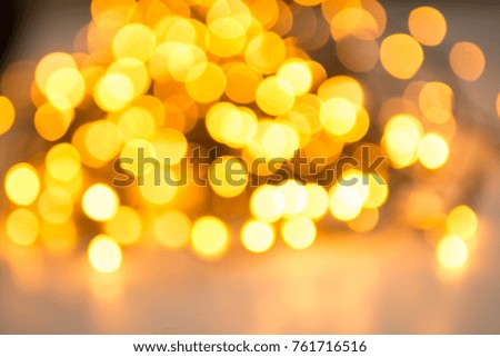 Christmas lights abstract with shiny yellow bokeh effect