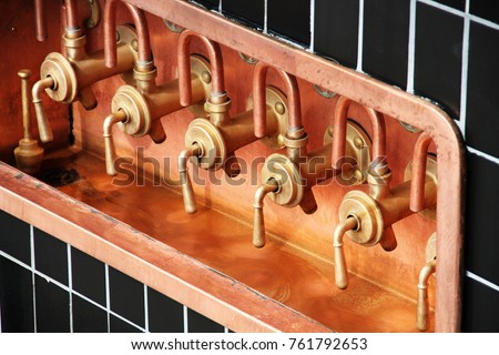 Beer taps in the factory Royalty-Free Stock Photo #761792653