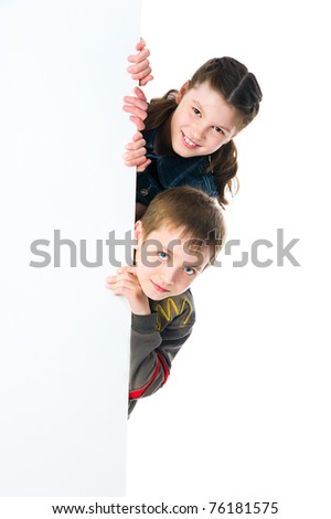 cute child behind a white board isolated