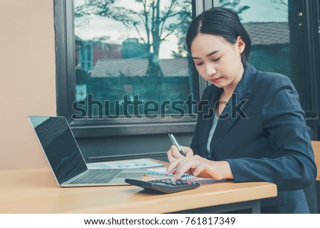 Business Woman sitting on Workplace , Beautiful girl sitting in a Coffee Shop and Working on Computer , Young Girl have a plan , Beautiful Woman have a marketing strategy.