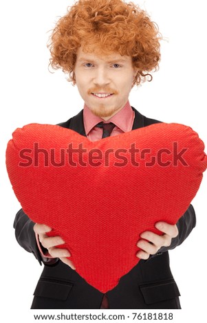picture of handsome man with red heart-shaped pillow