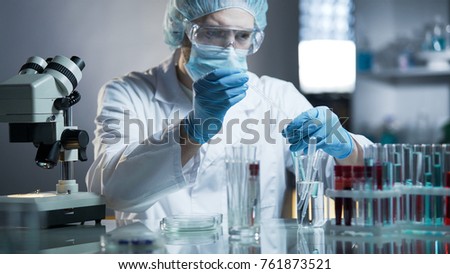 Laboratory worker measuring exact formula for hypoallergenic cosmetic products Royalty-Free Stock Photo #761873521