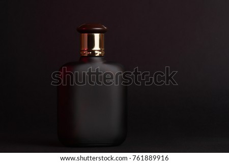 A bottle of male perfume Royalty-Free Stock Photo #761889916