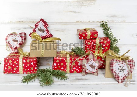 Christmas Present with Golden Bow on White Rustic Wooden Background. Festive Card