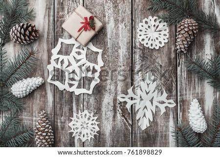 Old wooden. Fir branches, cones. Christmas Fellowship, New Year and Xmas. Space for Santa's message. Gift. Holiday card. Decorative snowflakes. Xmas and Happy New Year composition. Flat lay, top view