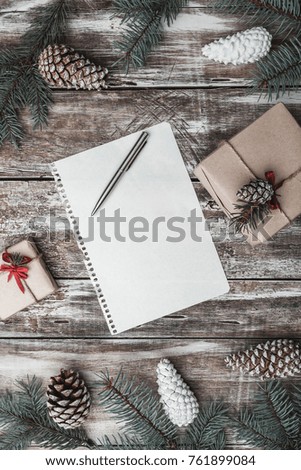 Old wooden background. Fir branches, cones. Christmas Fellowship, New Year and Xmas. Letter to Santa's message. Gifts. Holiday card. Xmas and Happy New Year composition. Flat lay, top view