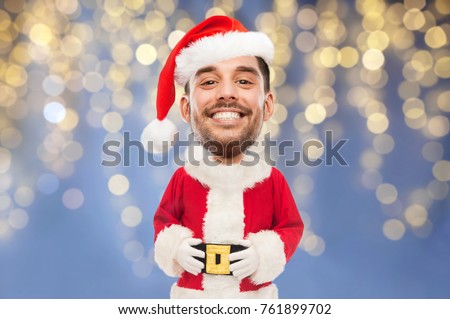 christmas, holidays and people concept - smiling man in santa claus costume over lights background (funny cartoon style character with big head)