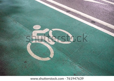 Street Bike lane in green color with white paint bicycle sign